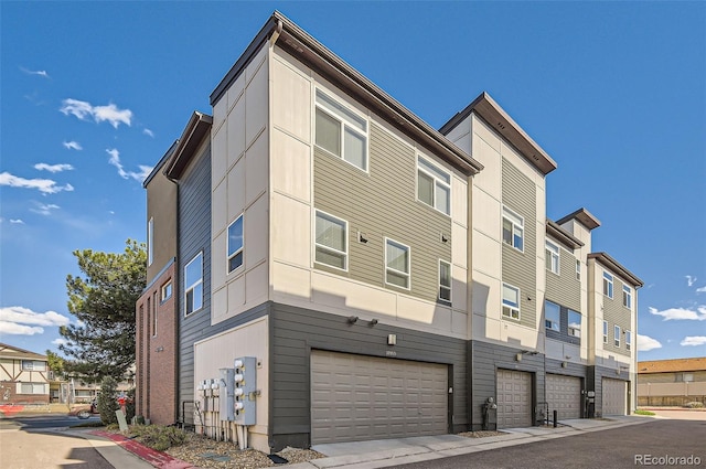 3795 Depew St Unit D, Wheat Ridge, CO 80212 - view of building exterior with an attached garage and a residential view