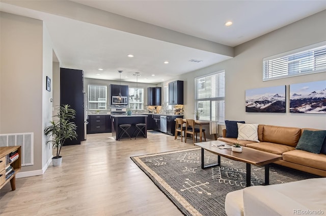 3795 Depew St Unit D, Wheat Ridge, CO 80212 - living room with recessed lighting and light wood finished floors
