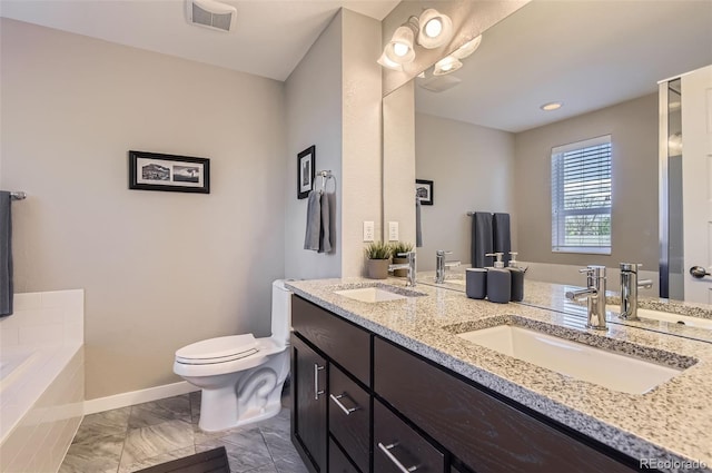 3795 Depew St Unit D, Wheat Ridge, CO 80212 - bathroom featuring double vanity, a garden tub, and marble look tile flooring