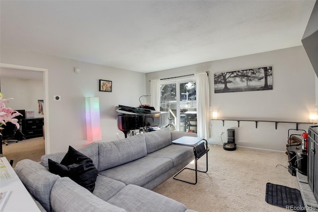 living room with baseboards and carpet flooring