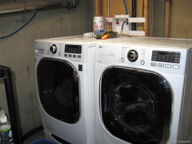 laundry area with laundry area and washer and dryer