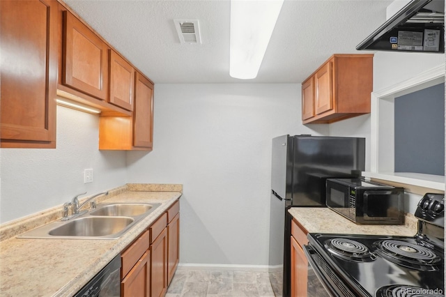 kitchen featuring a textured ceiling, sink, and black appliances