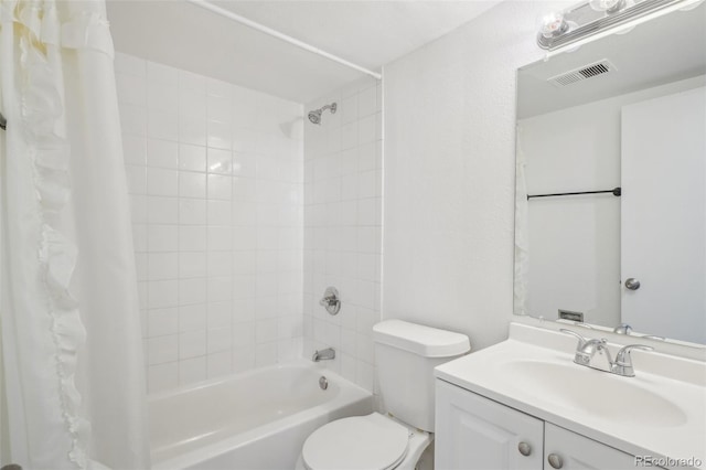 full bathroom with vanity, shower / bath combo, and toilet