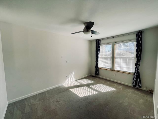 empty room featuring carpet floors, ceiling fan, and baseboards