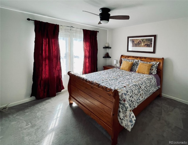 carpeted bedroom with a ceiling fan and baseboards