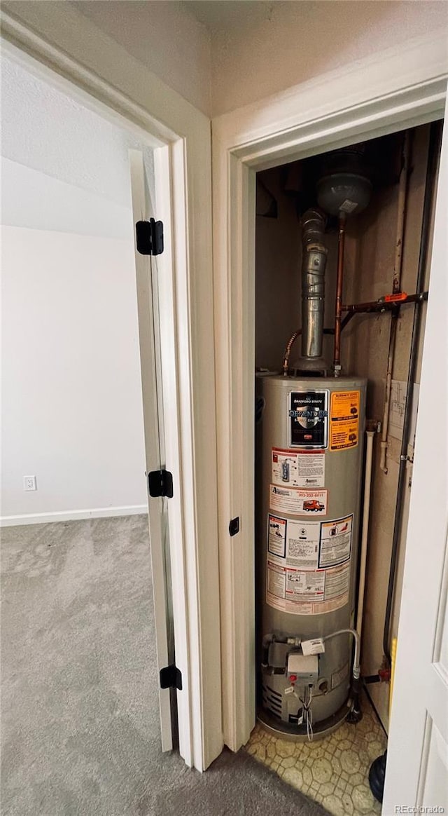 utility room featuring water heater