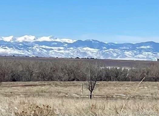 mountain view featuring a rural view