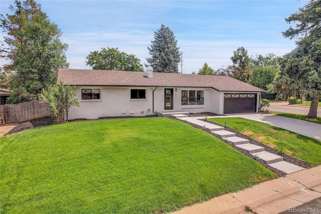 ranch-style house with fence, driveway, stucco siding, a front lawn, and a garage