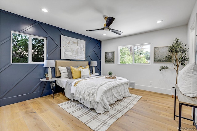 bedroom featuring ceiling fan and light wood-type flooring