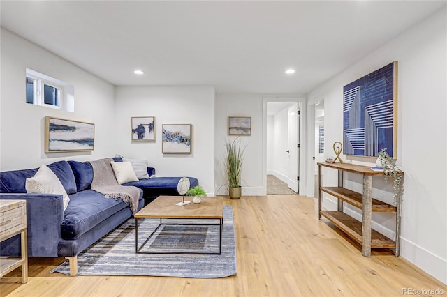 living room with light hardwood / wood-style flooring