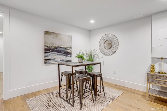 dining room with light hardwood / wood-style flooring