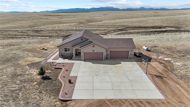 birds eye view of property featuring a mountain view