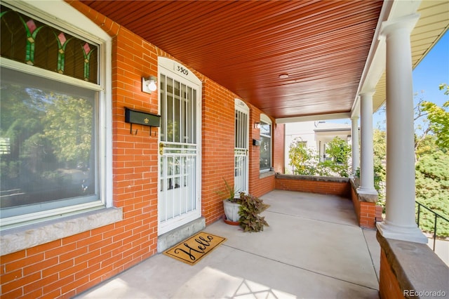 unfurnished sunroom with wooden ceiling