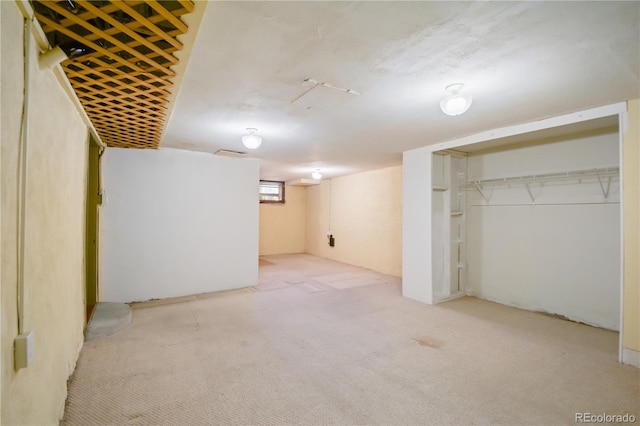 basement with light colored carpet