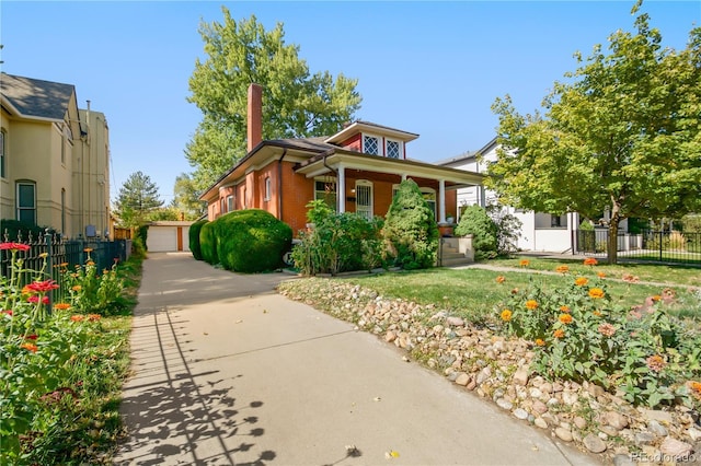 view of property exterior with a garage, an outbuilding, and covered porch