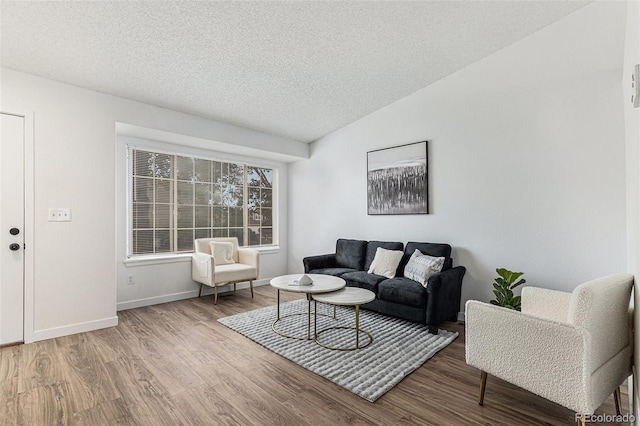 5068 E Crestone Ave, Castle Rock, CO 80104 - living room featuring wood finished floors, a textured ceiling, and baseboards