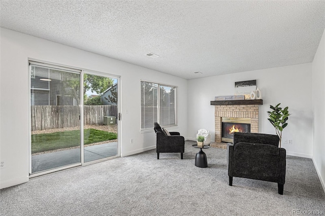 5068 E Crestone Ave, Castle Rock, CO 80104 - living room with carpet floors, a fireplace, baseboards, and a textured ceiling
