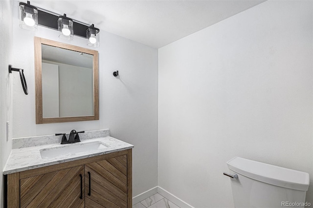 5068 E Crestone Ave, Castle Rock, CO 80104 - bathroom featuring toilet, vanity, marble finish floors, and baseboards