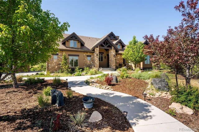 2480 Castle Butte Dr, Castle Rock, CO 80109 - view of front facade featuring stone siding