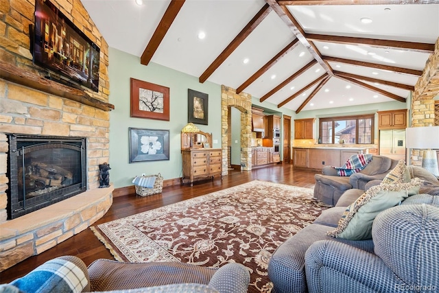 2480 Castle Butte Dr, Castle Rock, CO 80109 - living area featuring hardwood / wood-style floors, baseboards, high vaulted ceiling, a stone fireplace, and beamed ceiling