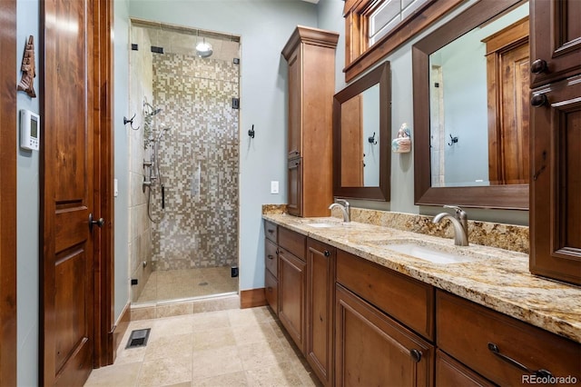 2480 Castle Butte Dr, Castle Rock, CO 80109 - full bath featuring a shower stall, double vanity, and a sink