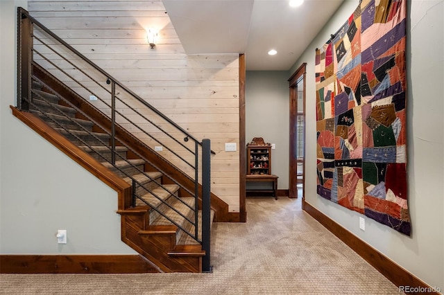 2480 Castle Butte Dr, Castle Rock, CO 80109 - stairs with recessed lighting, baseboards, carpet floors, and wood walls