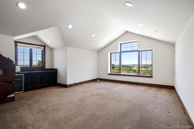 2480 Castle Butte Dr, Castle Rock, CO 80109 - bonus room featuring vaulted ceiling, recessed lighting, light colored carpet, and baseboards