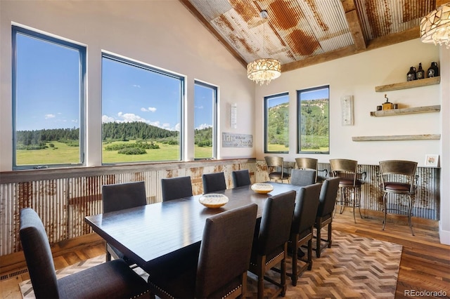 2480 Castle Butte Dr, Castle Rock, CO 80109 - dining area with vaulted ceiling and wood finished floors