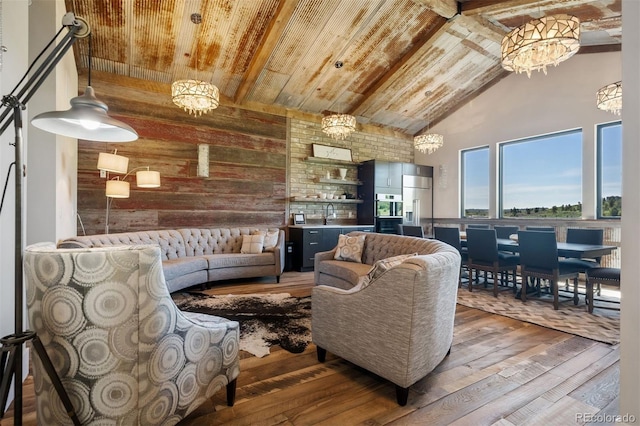 2480 Castle Butte Dr, Castle Rock, CO 80109 - living area featuring high vaulted ceiling, hardwood / wood-style flooring, wood walls, wooden ceiling, and beamed ceiling