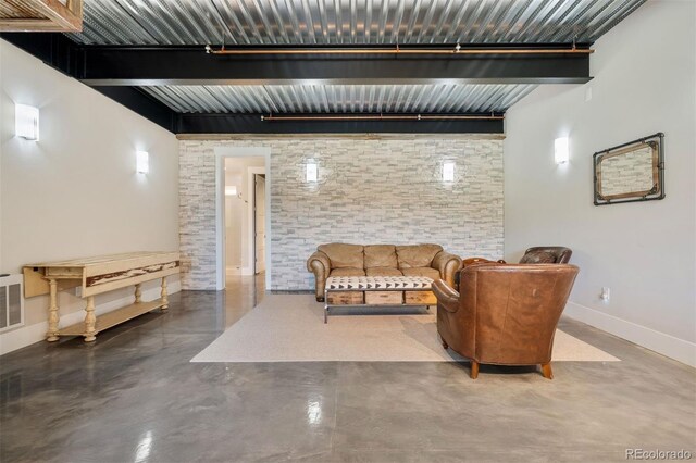 2480 Castle Butte Dr, Castle Rock, CO 80109 - sitting room with beamed ceiling, visible vents, baseboards, and concrete flooring