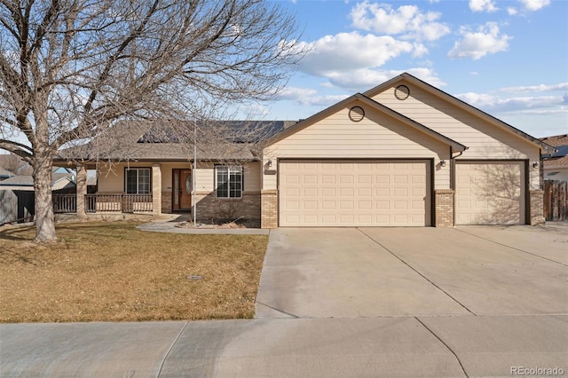 ranch-style house featuring a porch, concrete driveway, brick siding, and an attached garage