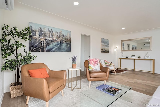 sitting room featuring recessed lighting, baseboards, and wood finished floors