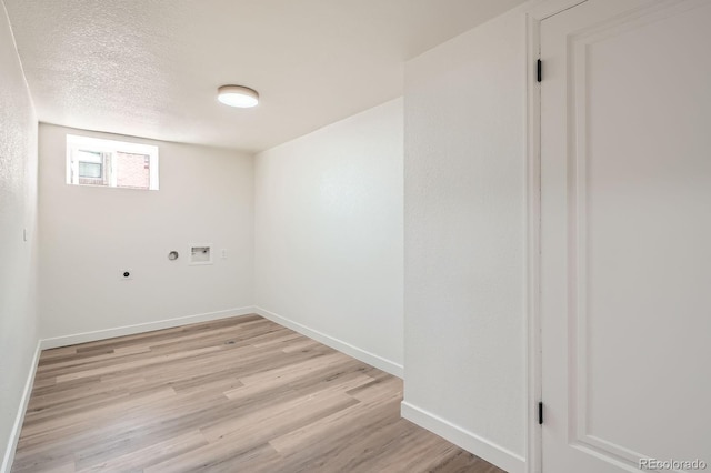 laundry room featuring light wood-type flooring, baseboards, hookup for an electric dryer, and washer hookup