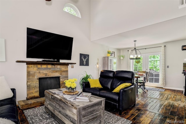 1156 White Stone Way, Fountain, CO 80817 - living area featuring wood-type flooring, plenty of natural light, a fireplace, and baseboards