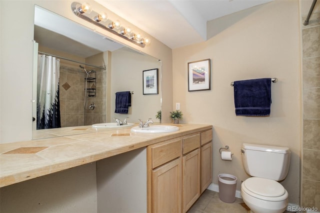 1156 White Stone Way, Fountain, CO 80817 - bathroom with toilet, double vanity, a tile shower, and tile patterned floors