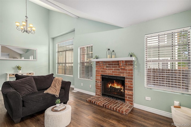 13118 Ash St, Thornton, CO 80241 - living area featuring a brick fireplace, wood finished floors, and a chandelier