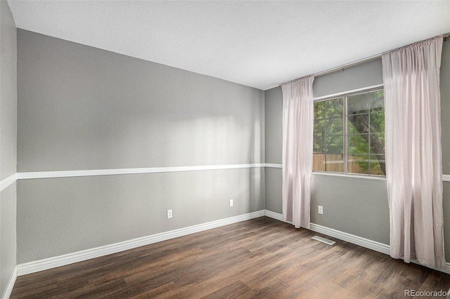 13118 Ash St, Thornton, CO 80241 - empty room with wood finished floors and baseboards