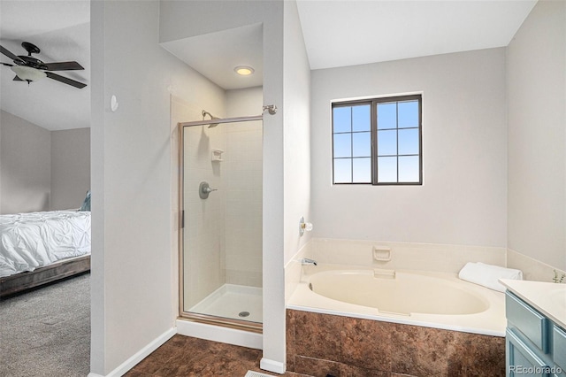 13118 Ash St, Thornton, CO 80241 - full bathroom with ensuite bath, a garden tub, a shower stall, a ceiling fan, and vanity