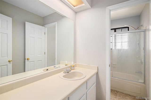 13118 Ash St, Thornton, CO 80241 - bathroom with vanity and bath / shower combo with glass door