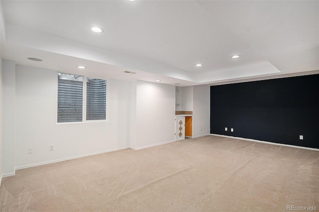 13118 Ash St, Thornton, CO 80241 - empty room featuring light carpet, recessed lighting, and a tray ceiling