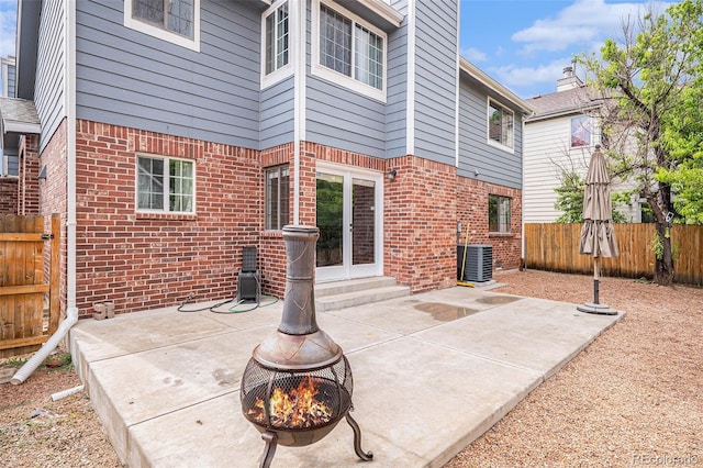 13118 Ash St, Thornton, CO 80241 - fenced backyard with a fire pit, a patio, and entry steps
