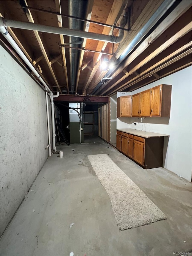 unfinished basement with heating unit