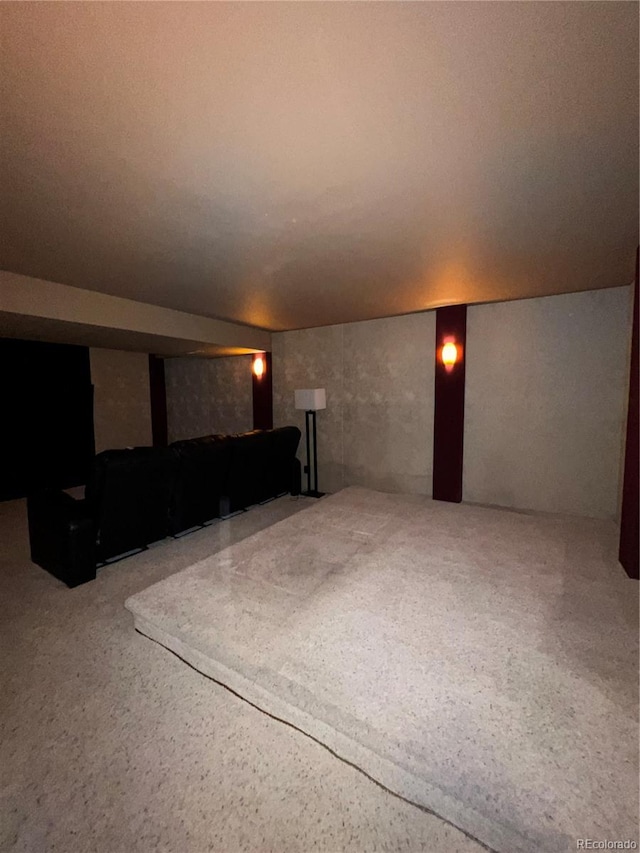 home theater room featuring speckled floor