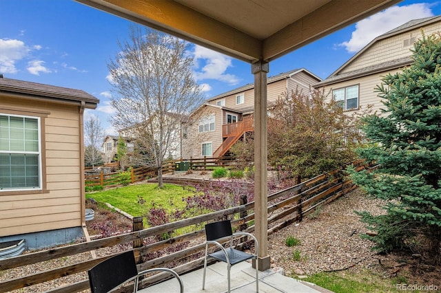 22310 E Chenango Dr, Aurora, CO 80015 - view of yard featuring a patio area, fence, and stairs