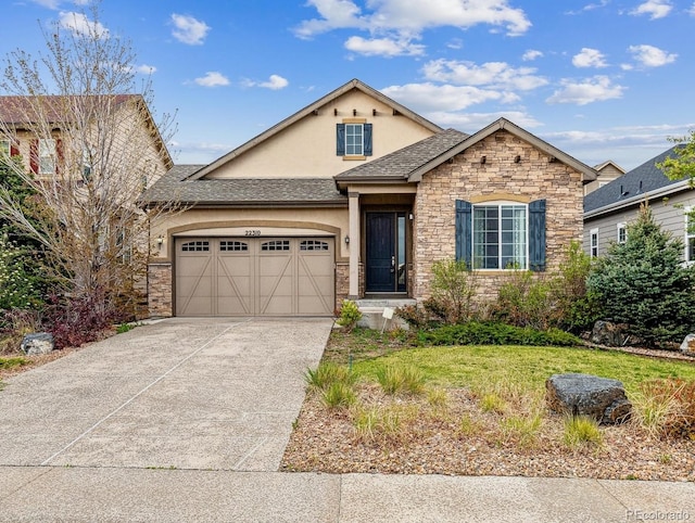 22310 E Chenango Dr, Aurora, CO 80015 - view of front of home with stucco siding, stone siding, an attached garage, and concrete driveway
