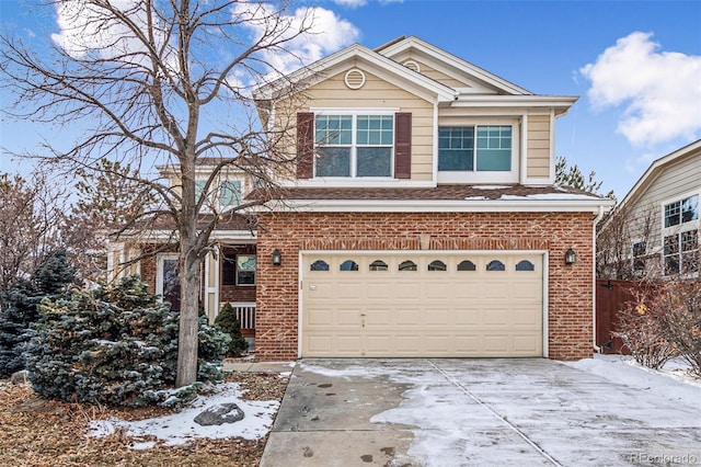 traditional-style house with a garage, concrete driveway, and brick siding