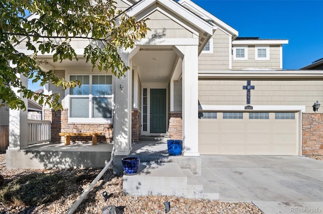 craftsman-style house featuring covered porch and a garage