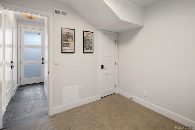 washroom with baseboards, visible vents, and carpet flooring