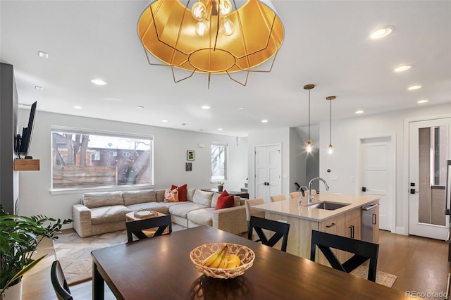 dining area with dark wood-type flooring and recessed lighting