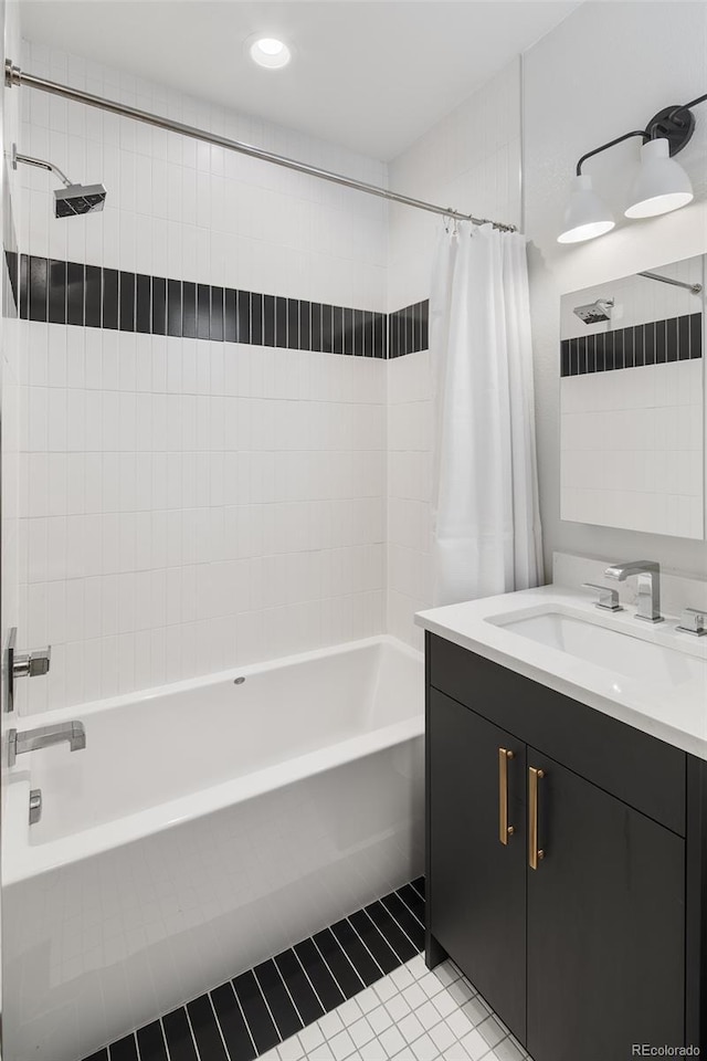 full bath featuring shower / bath combo, vanity, and tile patterned floors